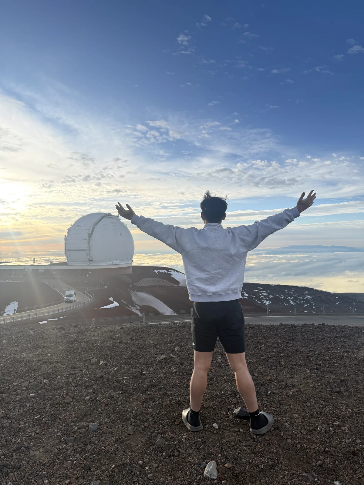 Tony looking out over mountains beside an observatory